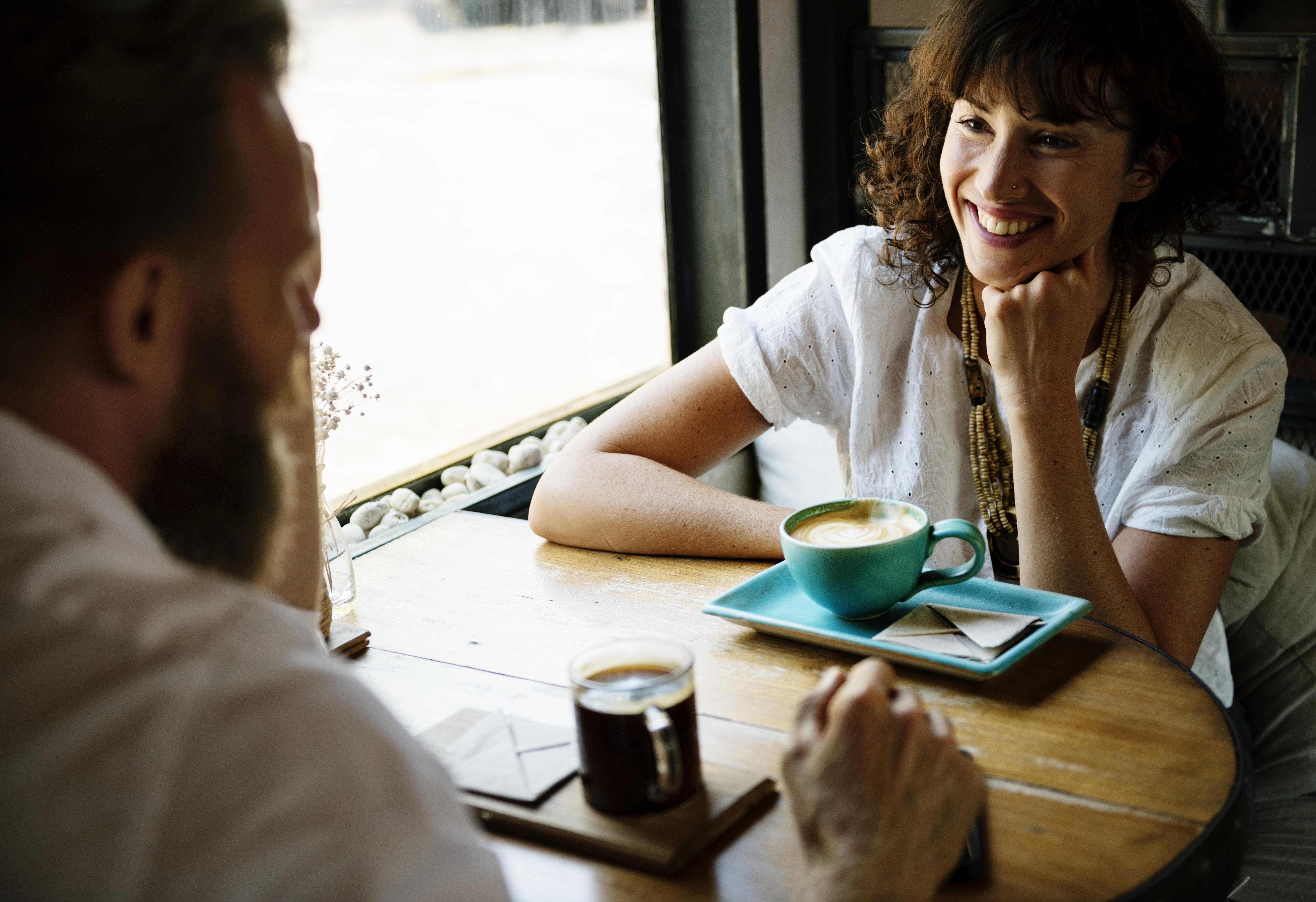 Woman and man drink coffee