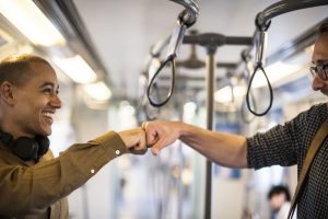 “How are you” in Polish — two men greeting on a subway