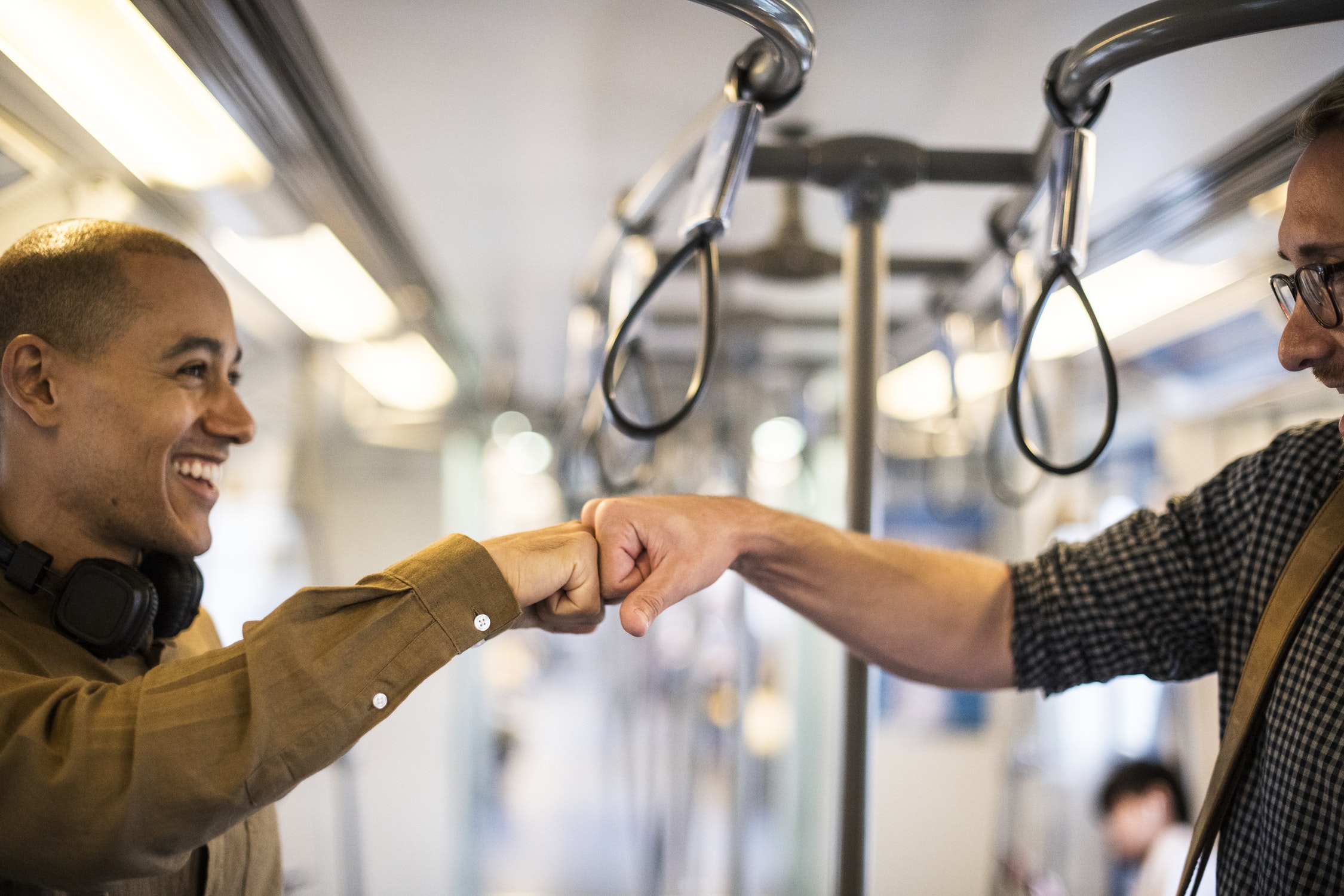 “How are you?” in Polish — two men greeting on a subway